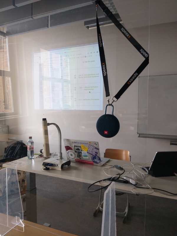 Setup with loudspeaker, two computers, beamer